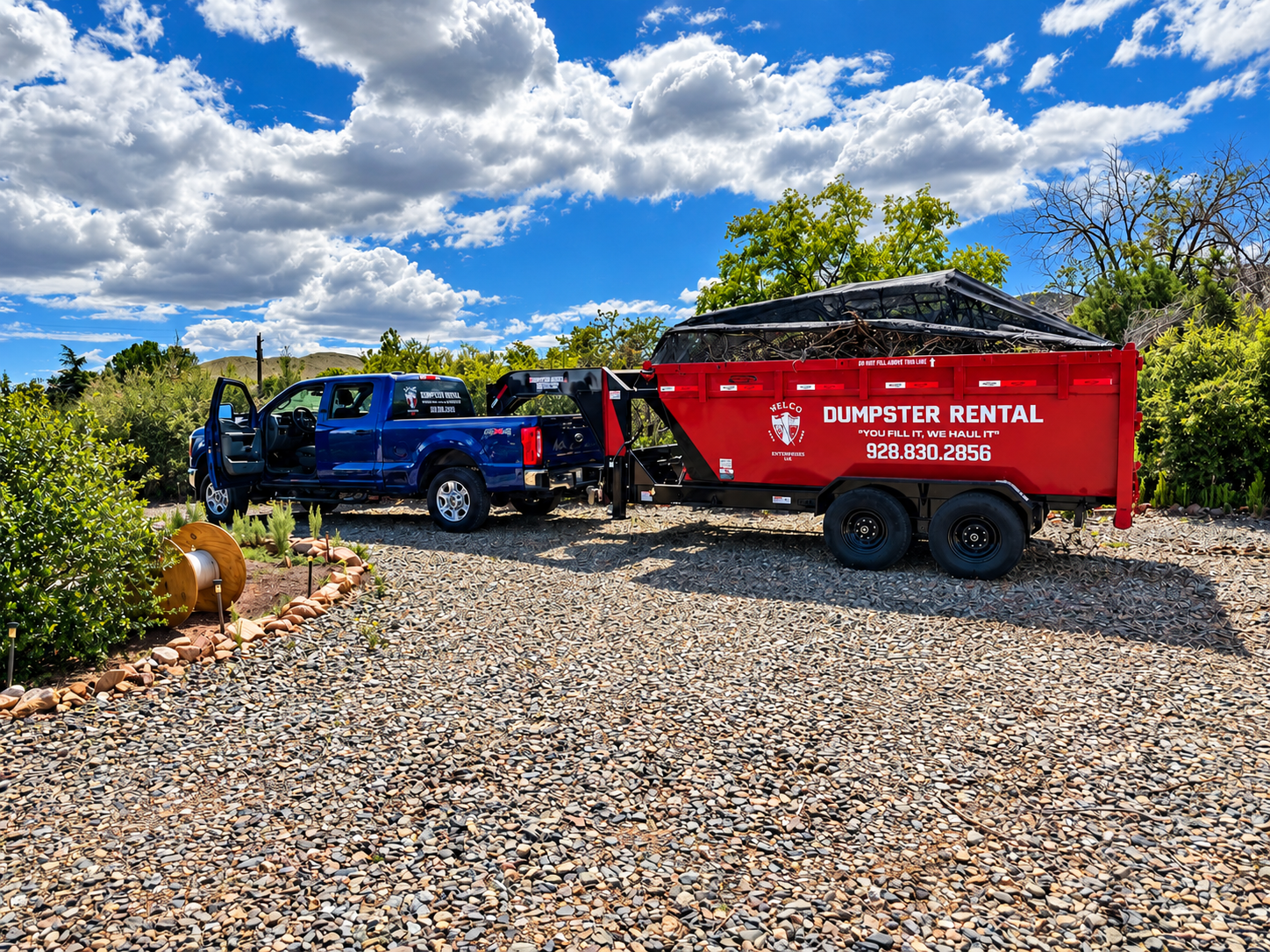 Nelco Enterprises dumpster rental truck and trailer on a gravel lot